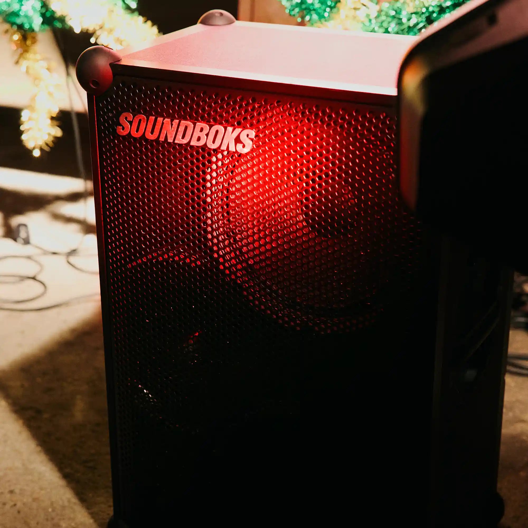 The Soundboks 4 on floor in red light